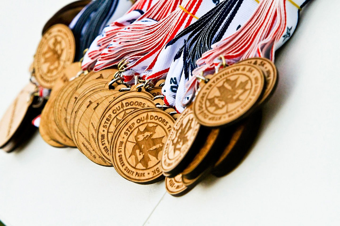 Tryathlon and 5K medallions.
